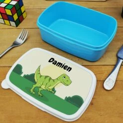 Boîte à Goûter & Gourde Enfant PersonnaliséesDinosaure : Cadeau Garçon 13 Boîte à Goûter & Gourde Enfant PersonnaliséesDinosaure : Cadeau Garçon -cadeaux boutique personnalisee Rentree scolaire inscription Dinosaure boite a gouter bleu ouverte 1