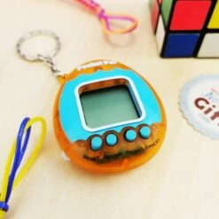 Pocket Pet - Porte Clé - Animal De Compagnie Numérique -cadeaux boutique pocket pet orange zoom